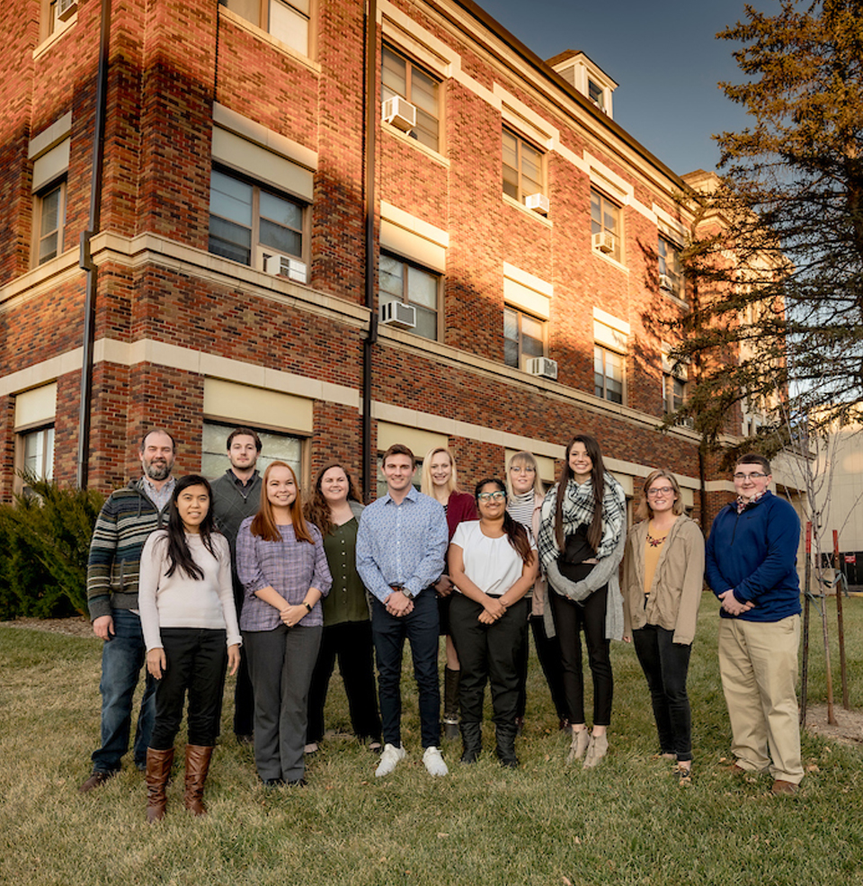 Psychology students stand outside of Psychological Service Center 