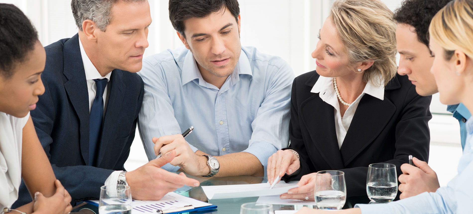 A group of business people talking.