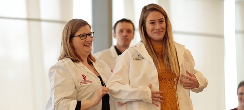 Speech language pathology students walking.