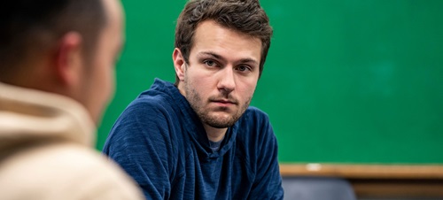 A student listening in the classroom.