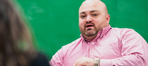 A man in a classroom.