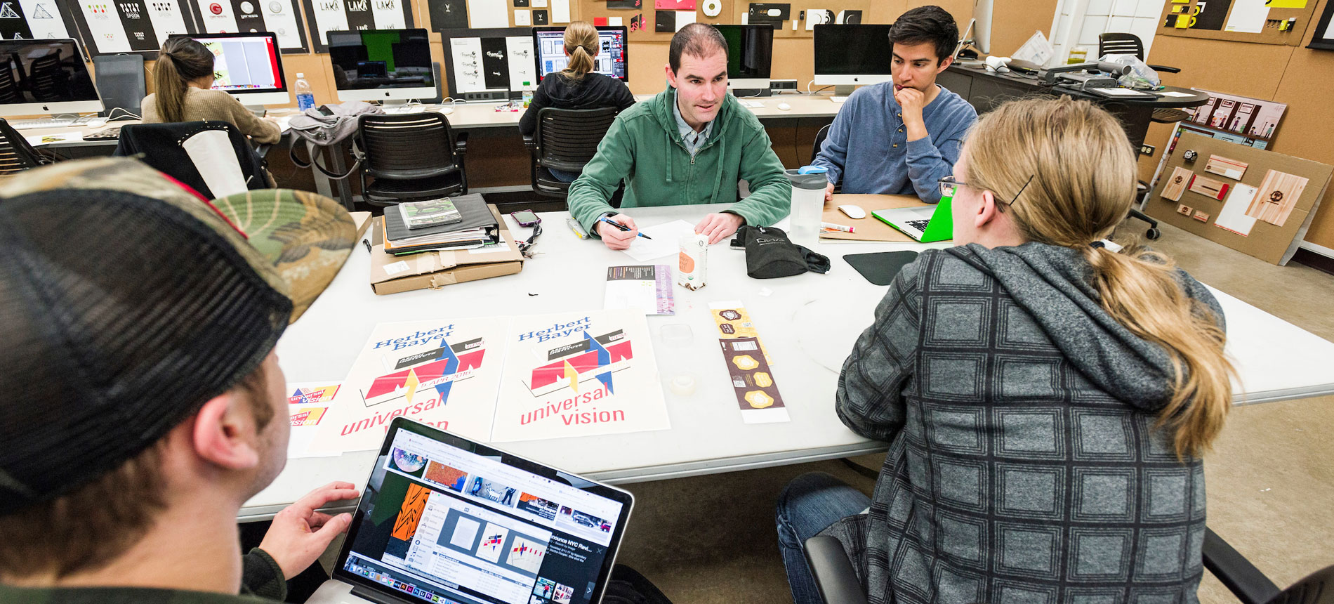 Graphic Design students critique package design renderings