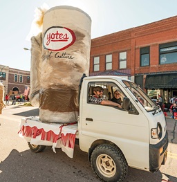 Students drive float in D-Days parade made by Sculpture Culture.