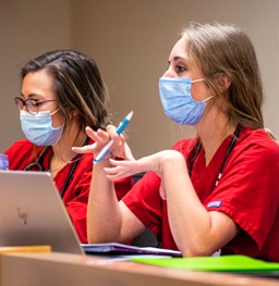 Two health students in class.