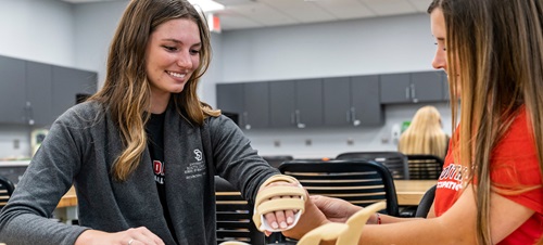 Two students working in the PT room.