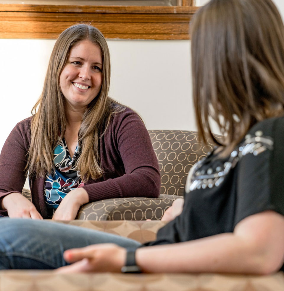 Two social work students talking.