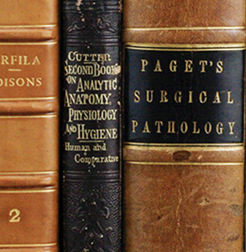 old medical history books on a shelf