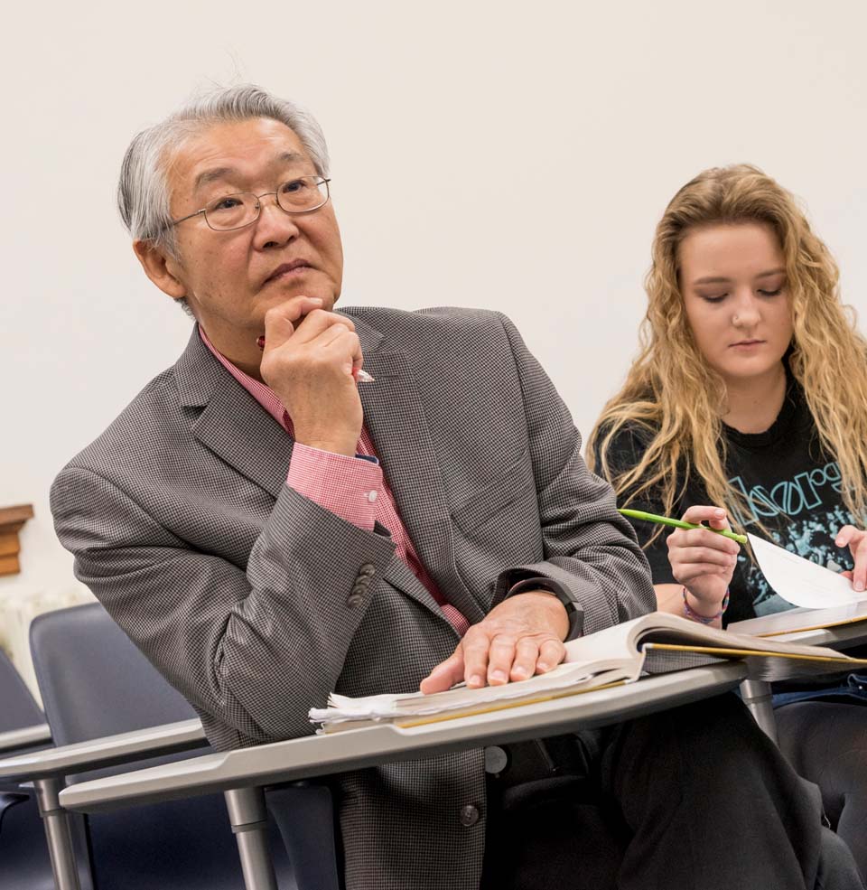 Older Man Student Listening to a Lecture