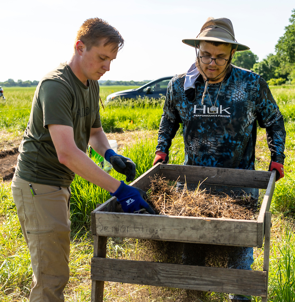 Two anthropology students doing field work.