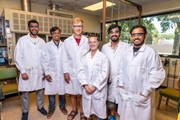 Chemistry professor with students in lab