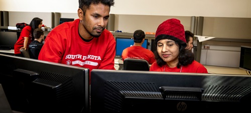 Students working together on a computer