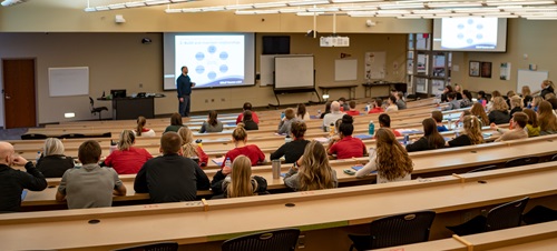 Students in a Lecture Hall Listening to a Disaster Response Presentation.