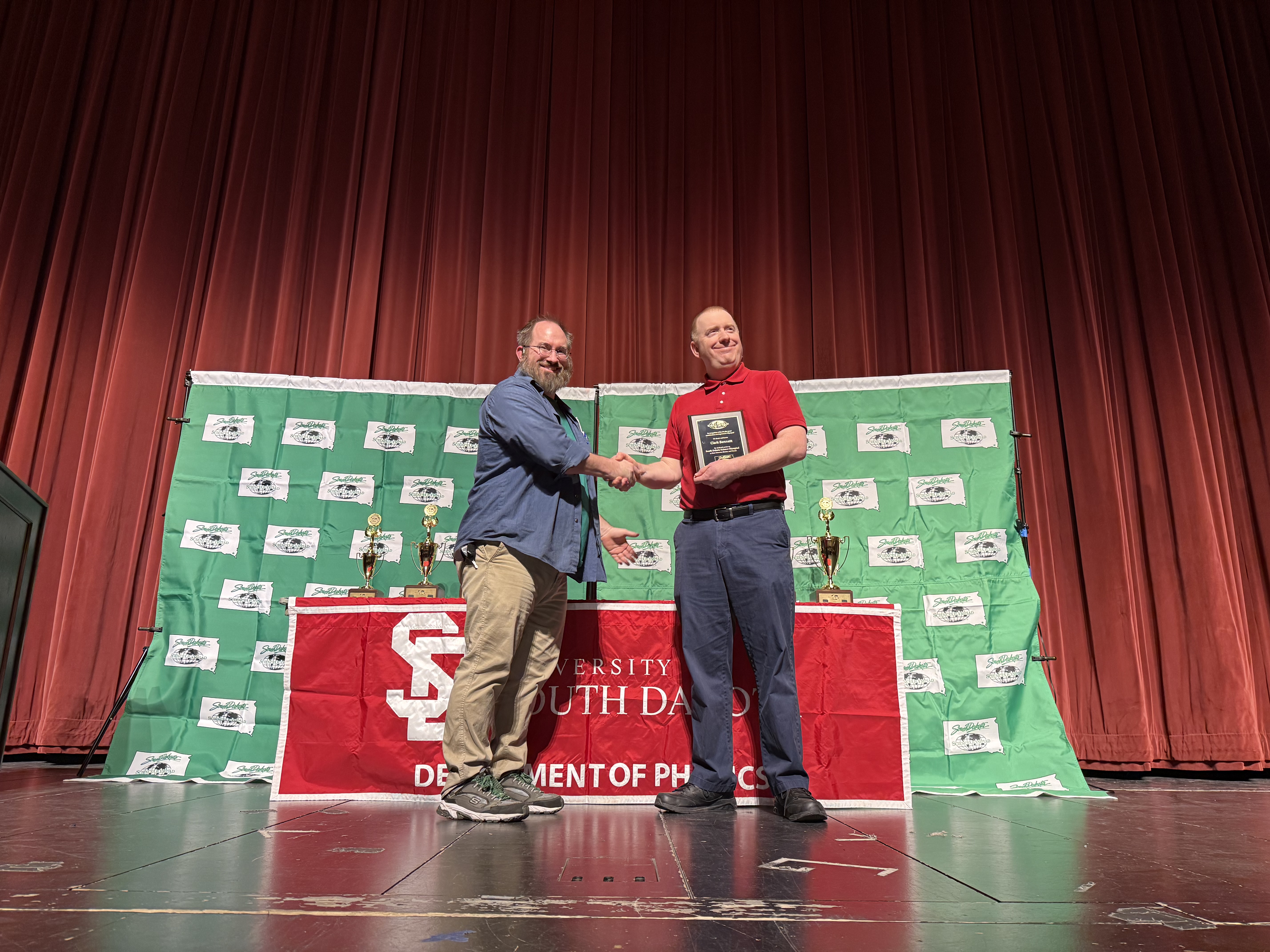 Clark Bennet receiving an award at the science Olympiad 2026
