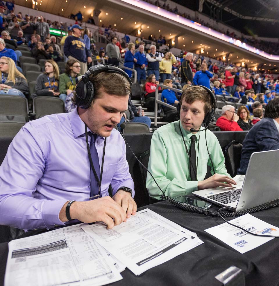 Two Male Students Sports Broadcasting a Basketball Game