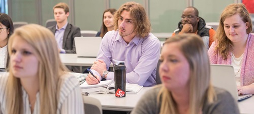 Students Listening to a Lecture in a Classroom.