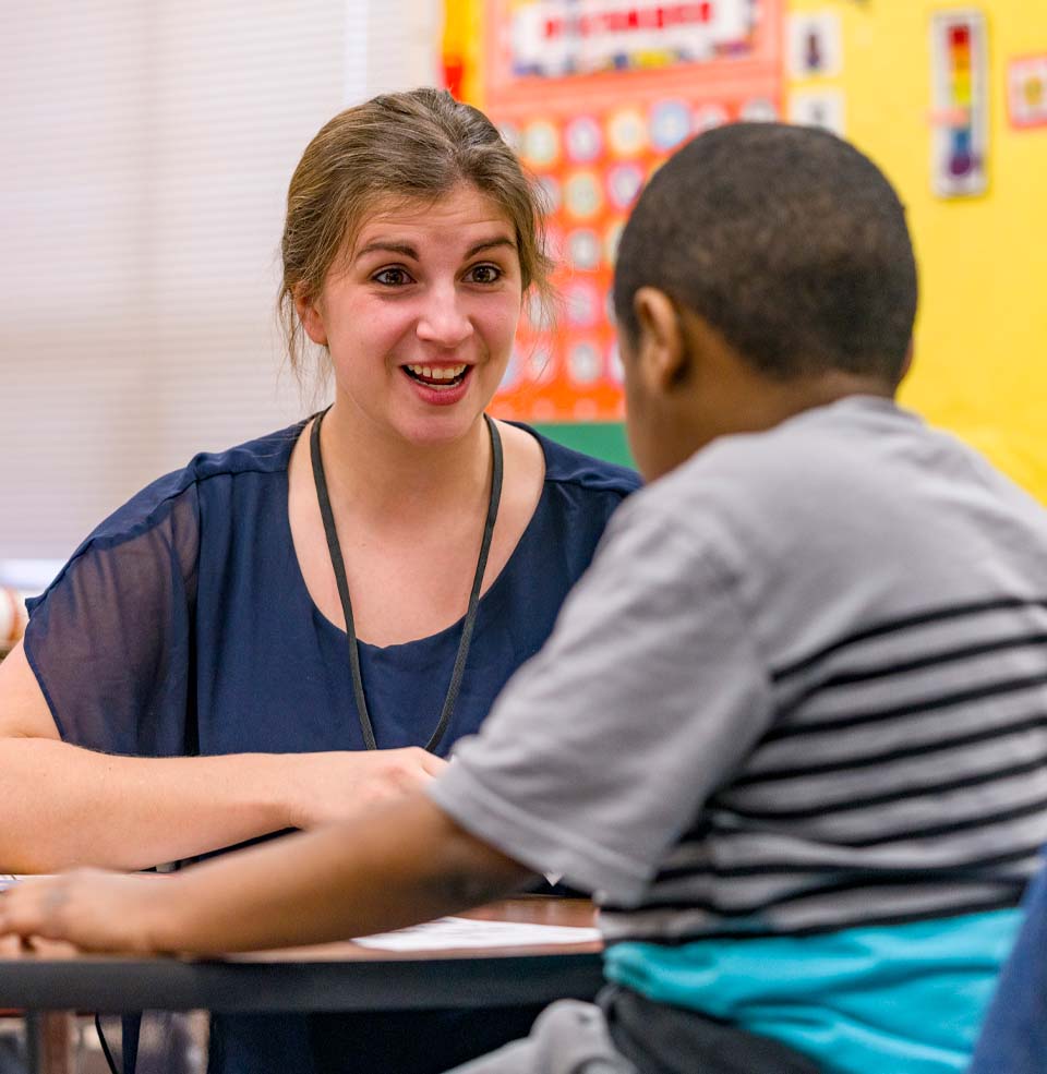 Teacher Working One-On-One with a Young Student