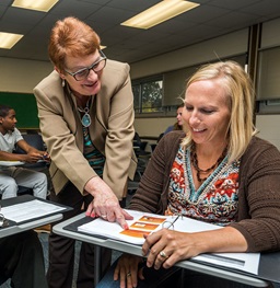 A teacher speaking to a student.
