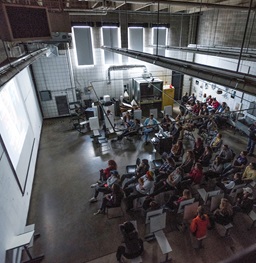 Students studying in a dark classroom.