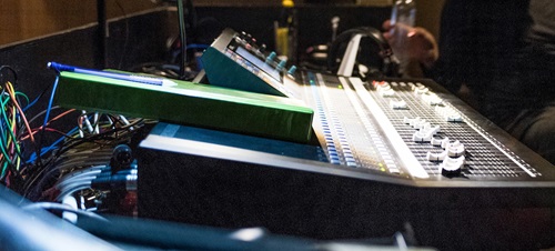 A student on an operating music board during a production.