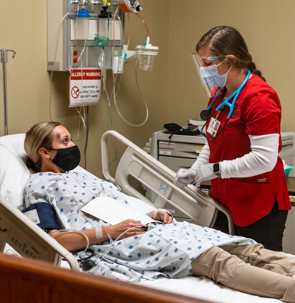 Student Gaining Hands-On Experience Working With a Patient Inside a Clinic