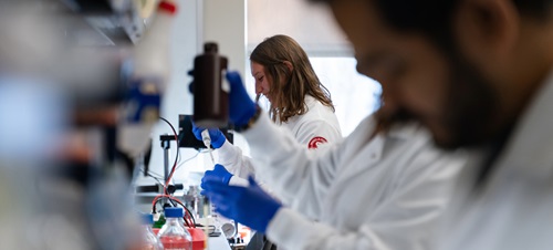 Med students analyzing data in a lab.