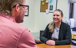 People meeting and talking at a table