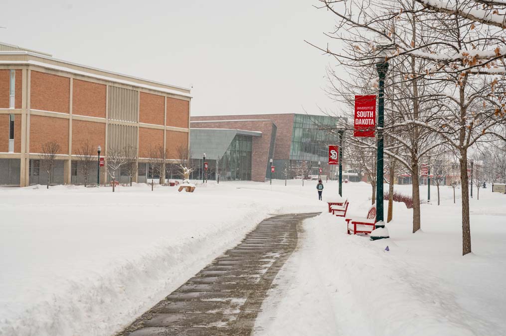 Campus Covered in Snow With I.D. Weeks Library and Muenster University Center in Background