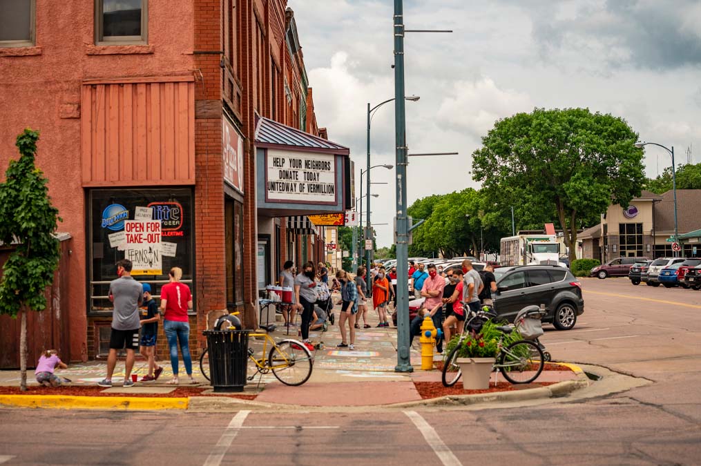 Community Members Chalking Sidewalks Downtown Vermillion