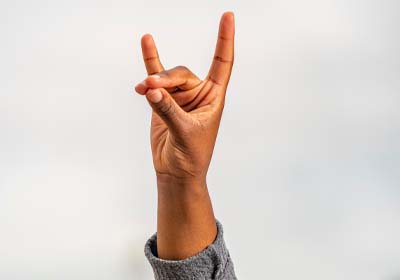 Hand showing the Yote sign