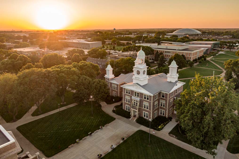 Iconic Old Main at sunset from a drone