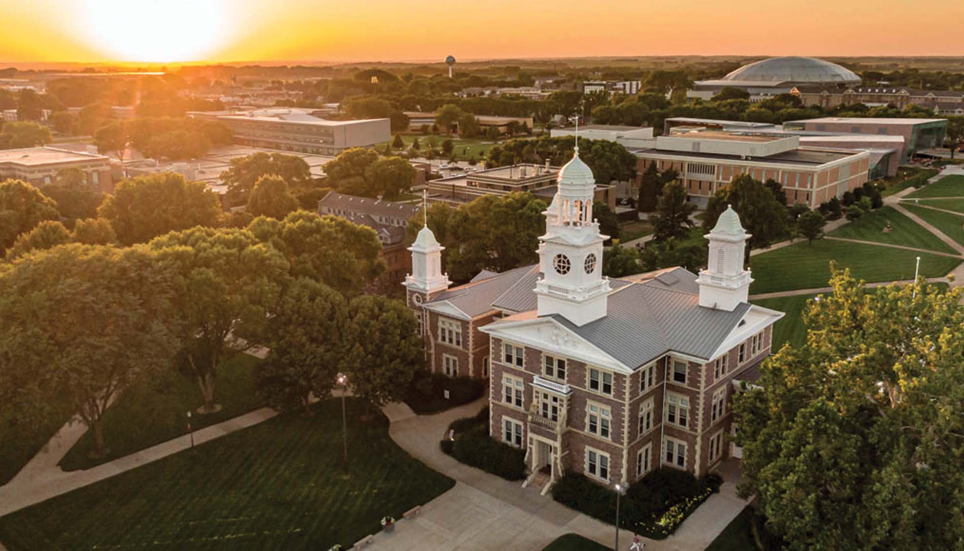Beautiful aerial photo of campus featuring Old Main in the lower front
