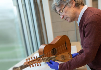 Darryl Martin working on a string instrument.