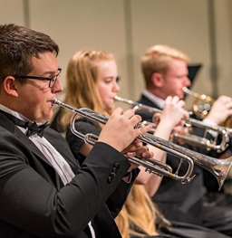USD Symphonic Band students playing the trumpet.