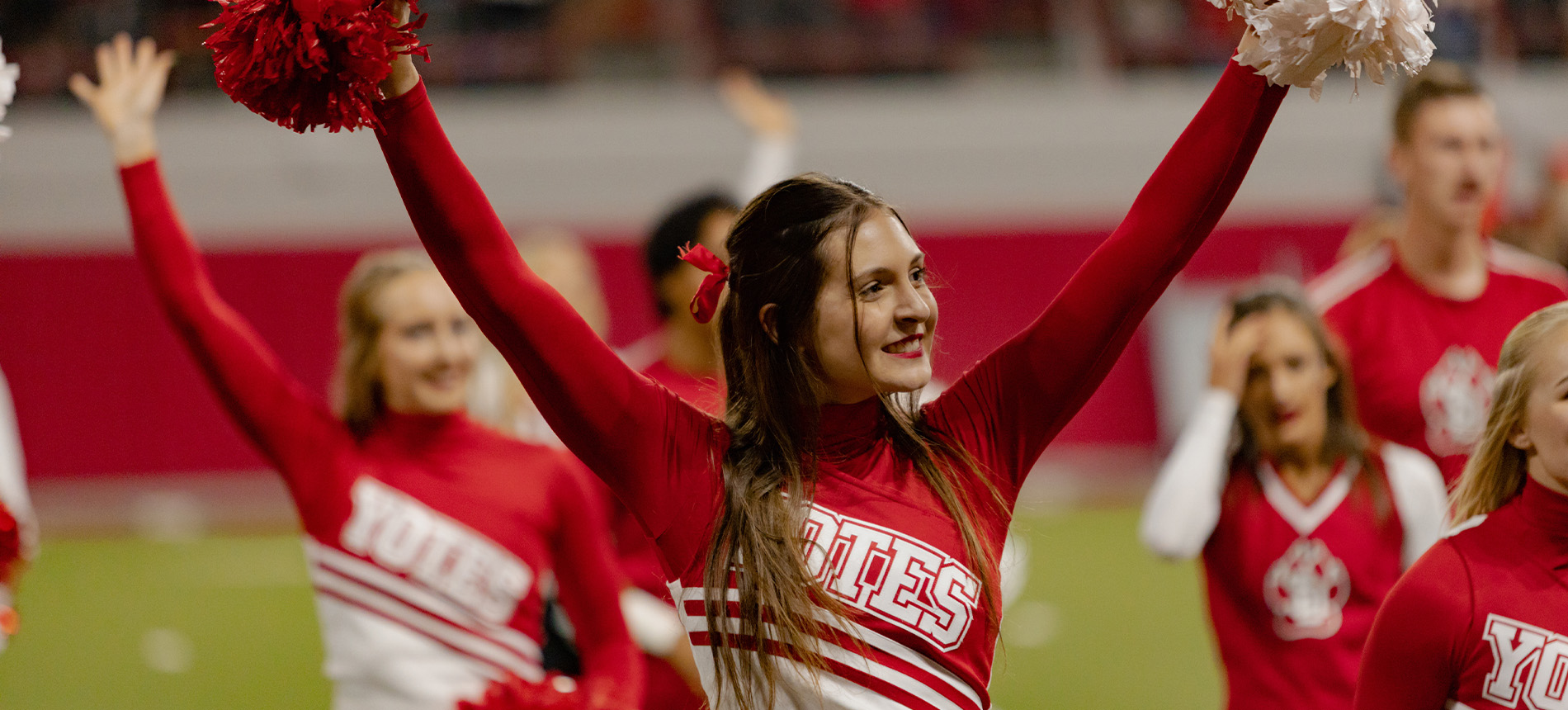 The Cheer team at a football game.