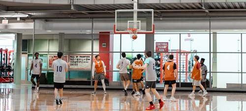 USD students playing basketball.
