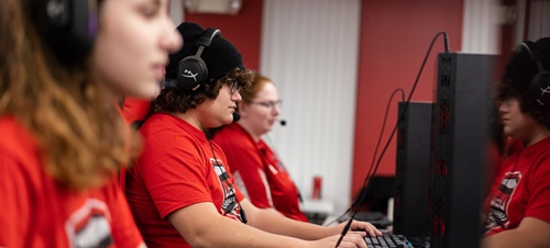 Esports students competing on their computers
