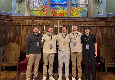 Sigma Alpha Elpsilon group photo in a church. 