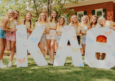 Kappa alpha theta girls smiling for a photo.