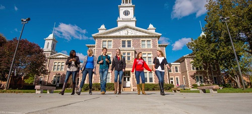 Students walking together in front of iconic Old Main
