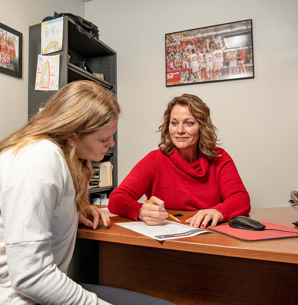 A student meeting with a counselor.