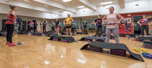 People in a Body Pump class in the Wellness Center