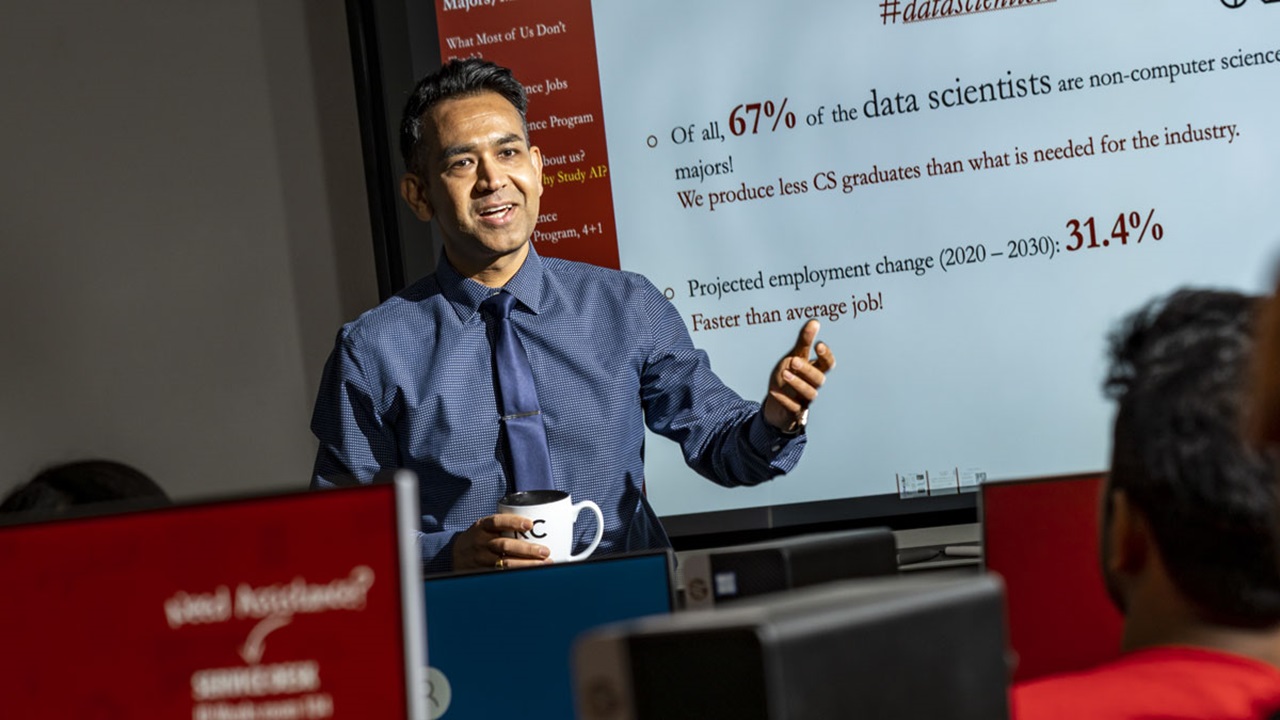 KC Santosh teaches a class and his powerpoint says Why Study AI KC Santosh teaches a class and his powerpoint says Why Study AI