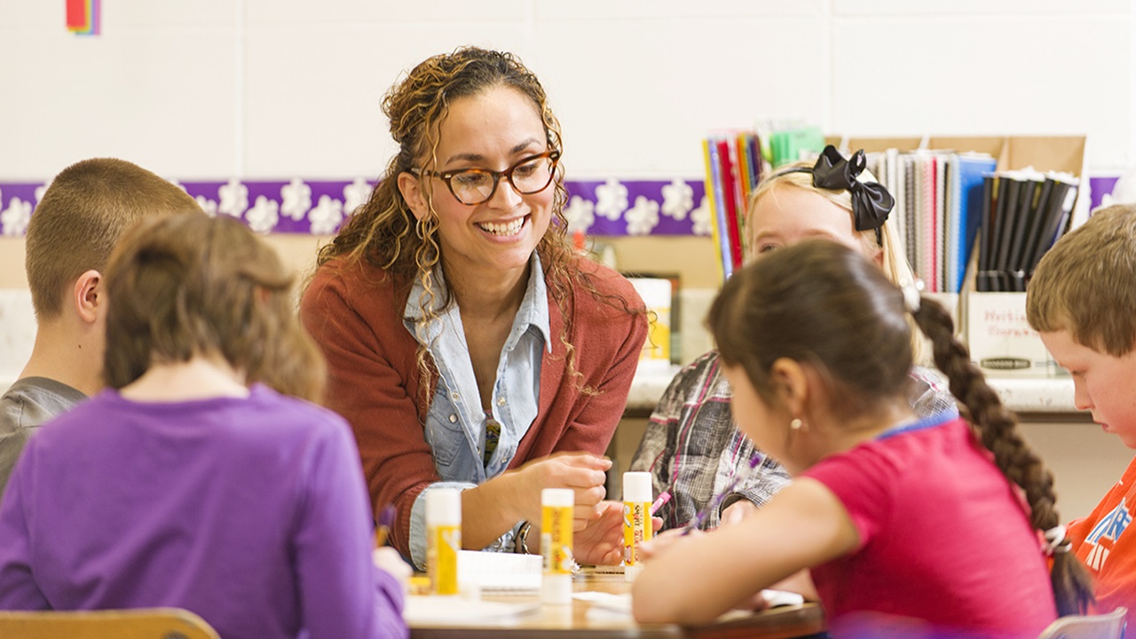 Student teacher helps students Student teacher helps students