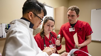 Three USD students work together to solve health situations