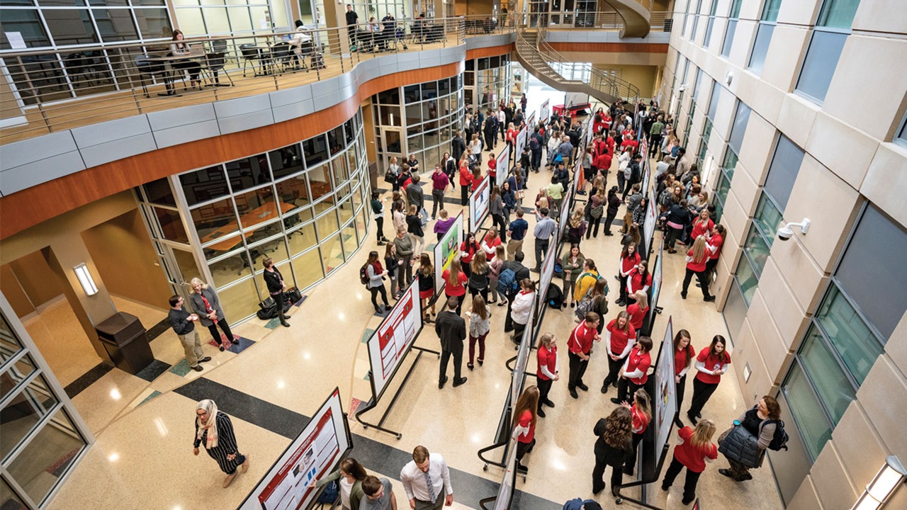 USD students, faculty and staff mingle at a research conference. USD students, faculty and staff mingle at a research conference.