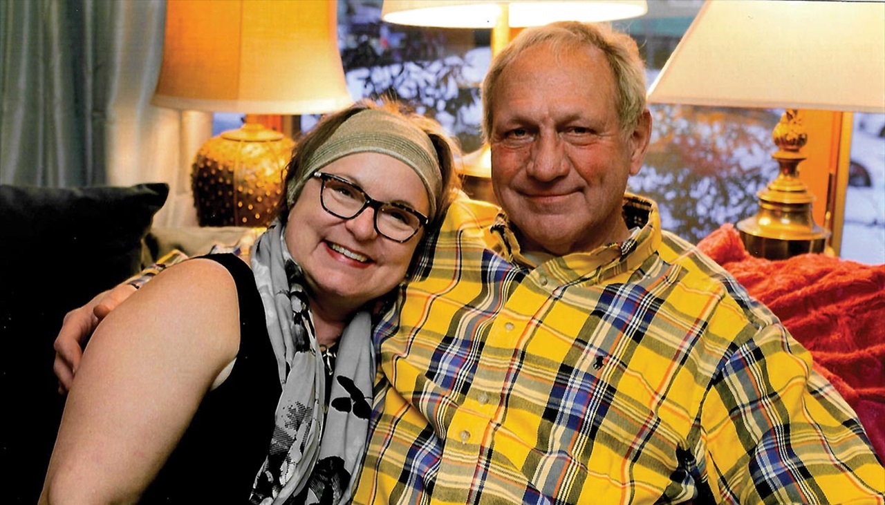 Photograph showing Nancy and Melvin W. Thomas sitting on a couch together on Mel's 70th birthday on February 9, 2018