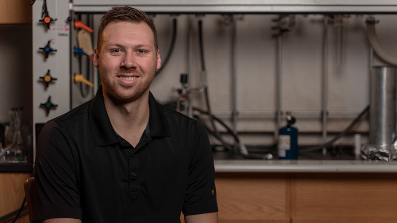 A portrait of Brady Samuelson in a lab.