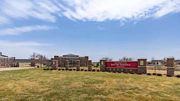 An exterior shot of USD - Sioux Falls campus and the USD Discovery District