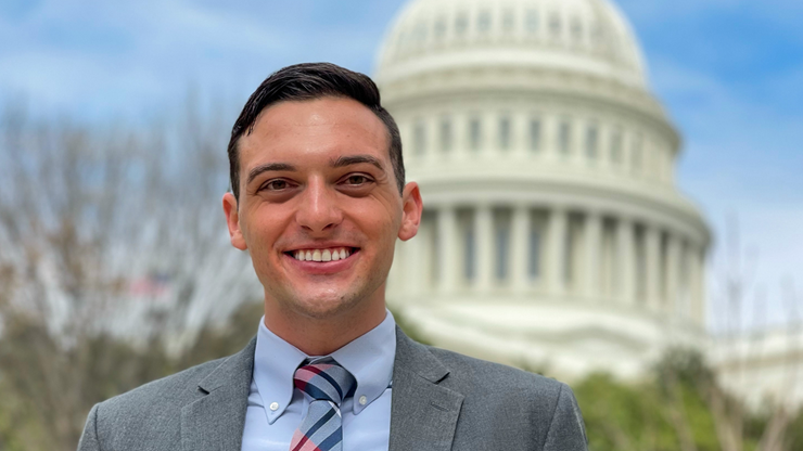 A photo of Josh Sorbe in front of the United States Capitol.