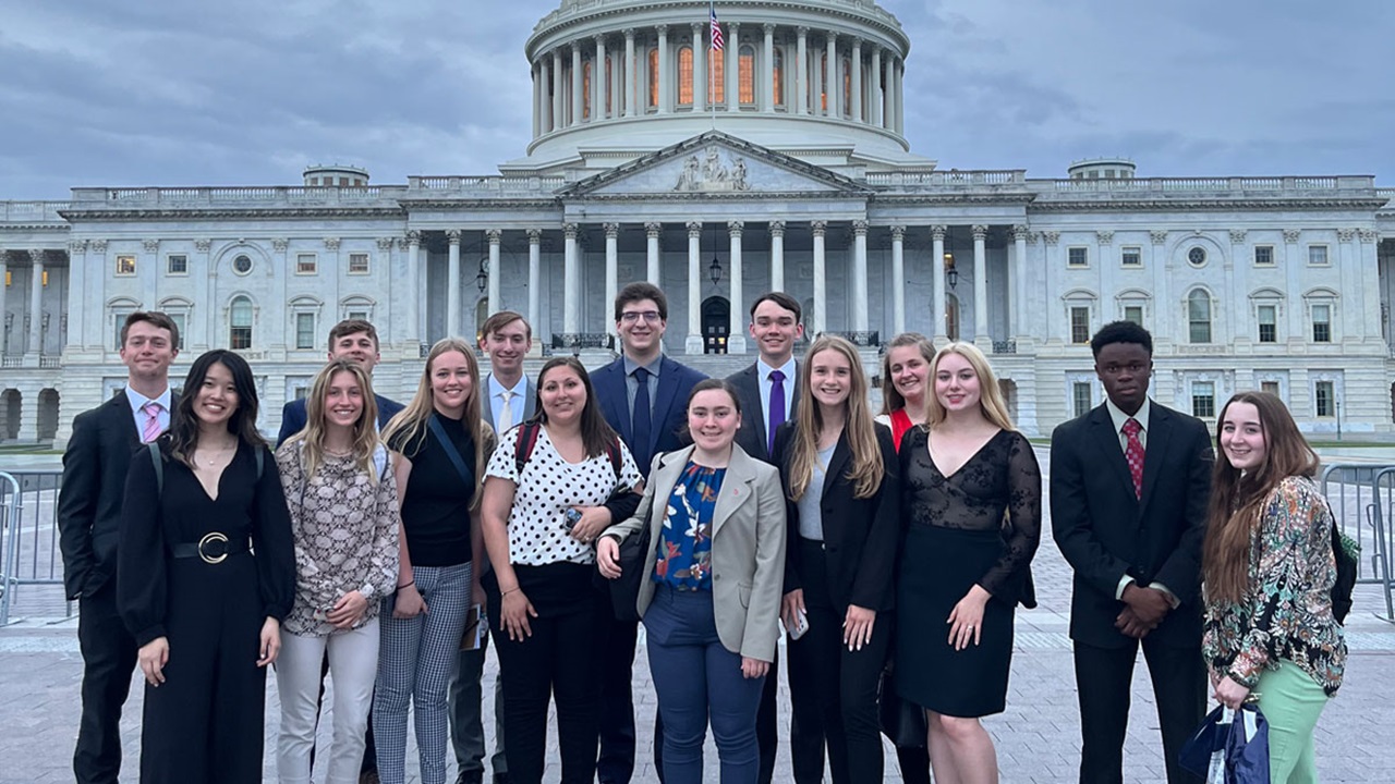 DC alumni summer program students standing in front of US capitol building